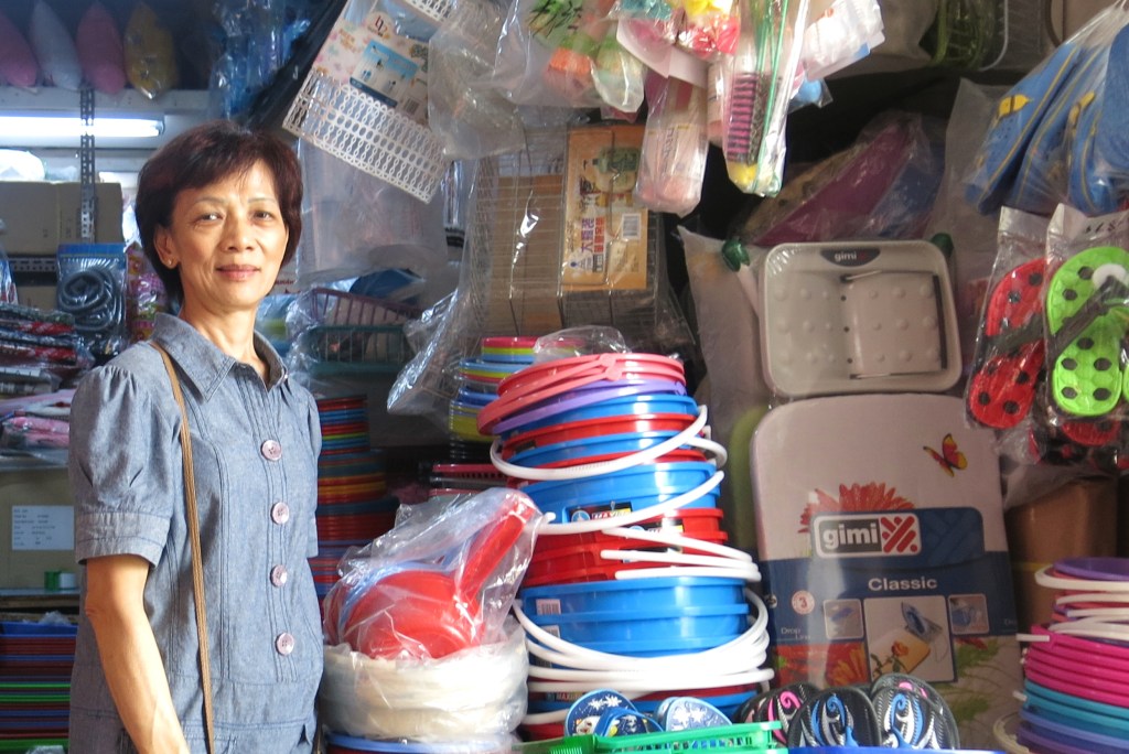 Shop selling brooms, buckets, and other cleaning supplies at Eunos Circle in Singapore - Shopkeeper Stories