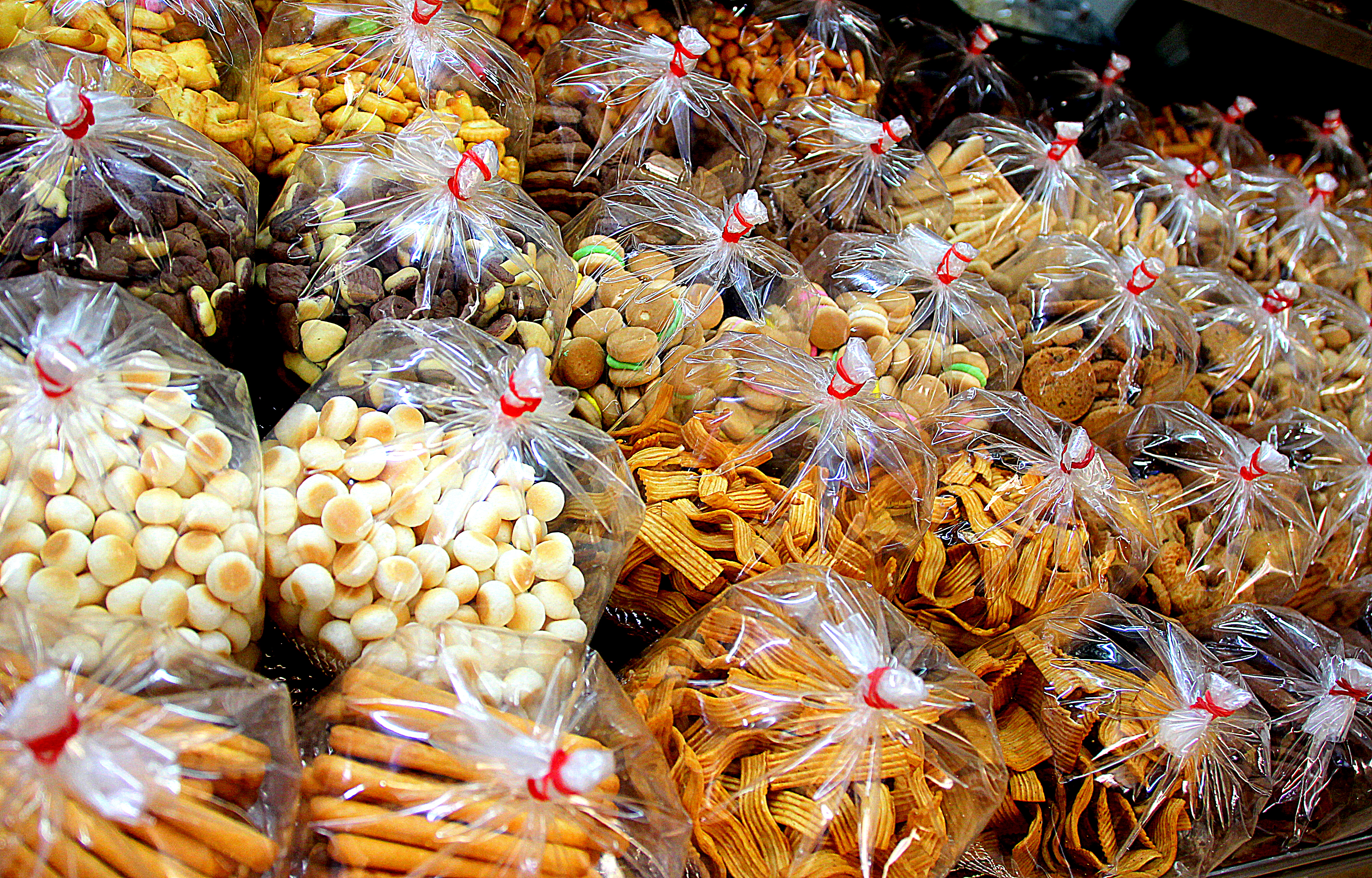 Junk food at the market in Singapore selling biscuits, dried fruits, and other snacks | Shopkeeper Stories
